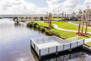 Boardwalk on the river looking towards bridge