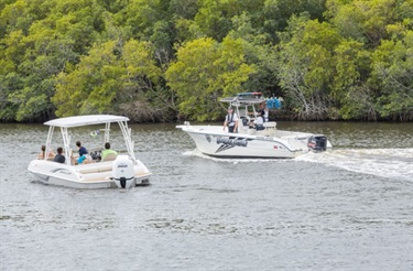 police boat approaching resident boat