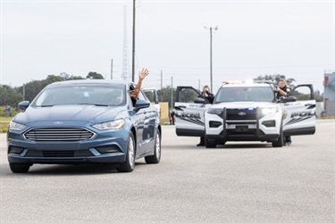 Police officers pulling vehicle over in training exercise