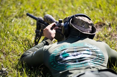 swat aiming in grass