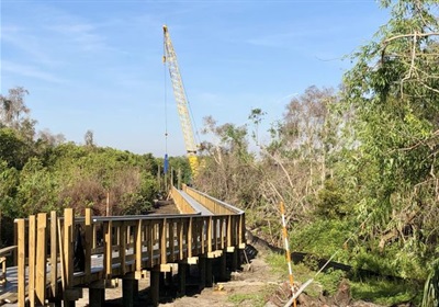 Riverwalk Boardwalk main span pilings connect with Bridge Plaza span on 3/16/20