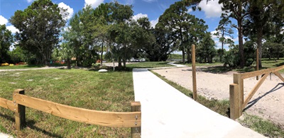 June 2020 - fence installation sidewalk parking lot to banyan tree