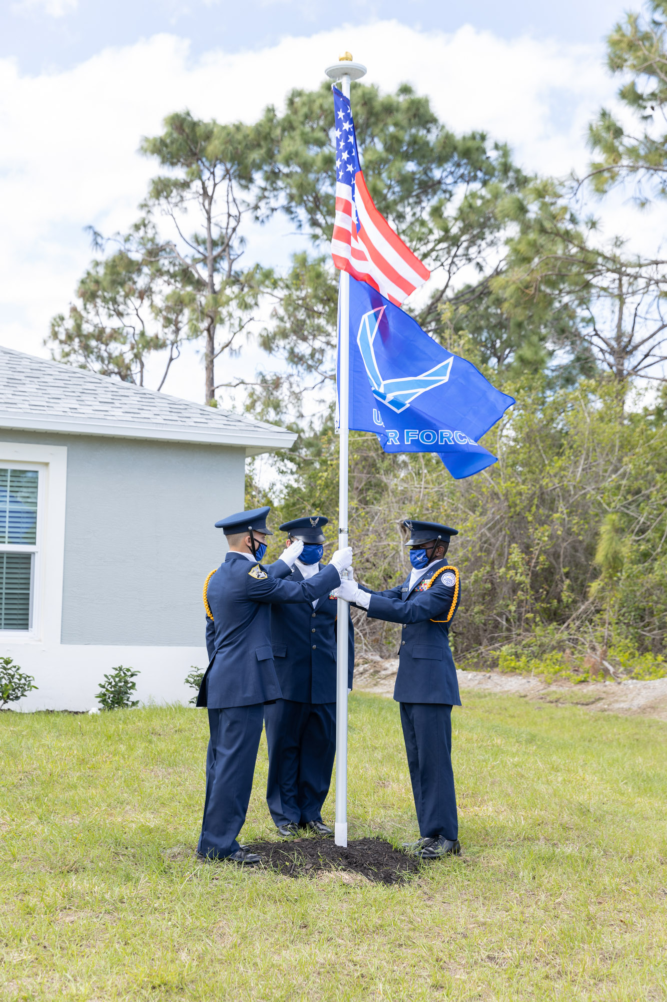 Flagpole waving Air Force and American flags