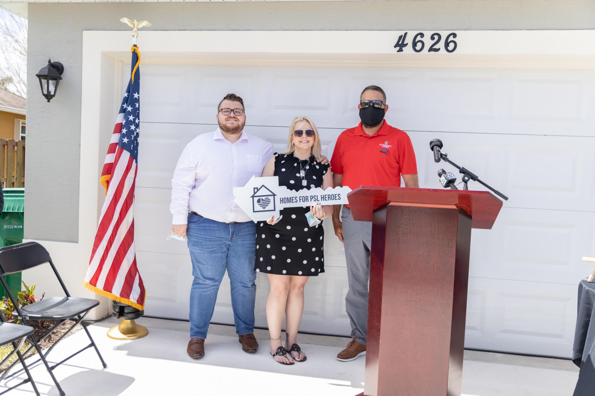 Heintz family receiving Home For Heroes key