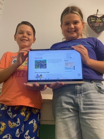 Kids holding laptop with online recycling activities