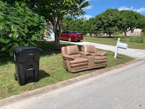 Garbage cart, bulk couch and mailbox